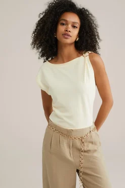 jersey top met gouden accenten
