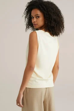 jersey top met gouden accenten