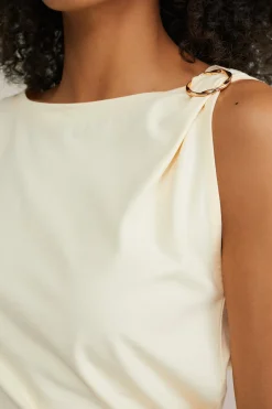jersey top met gouden accenten